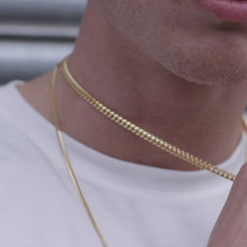 Gold Cuban link chain close up