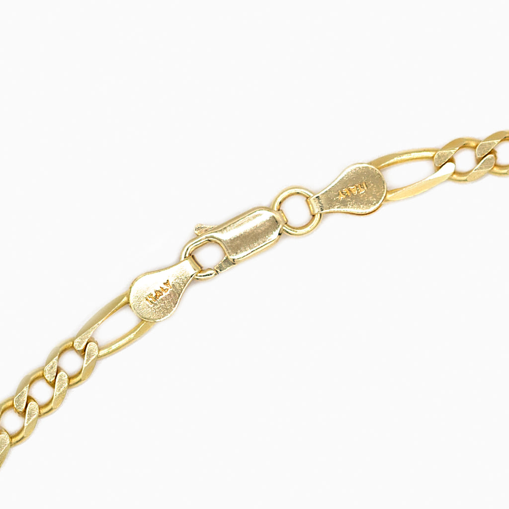 Gold Figaro bracelet lobster clasp close up