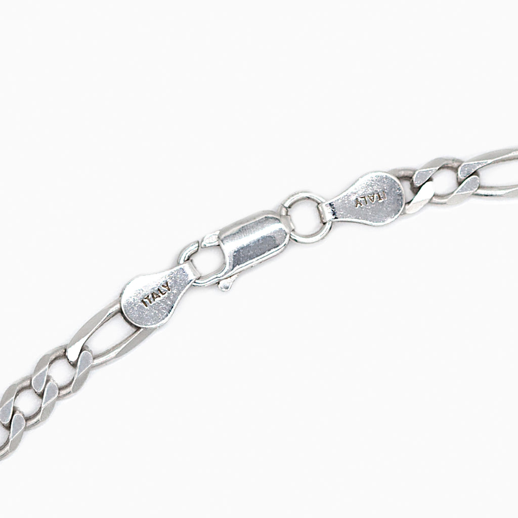 Silver Figaro bracelet lobster clasp close up